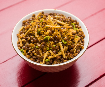 If you want to eat something crunchy and spicy, then Dalmoth is a must-try. It is a delicious mixture of fried lentils, nuts and spices. 